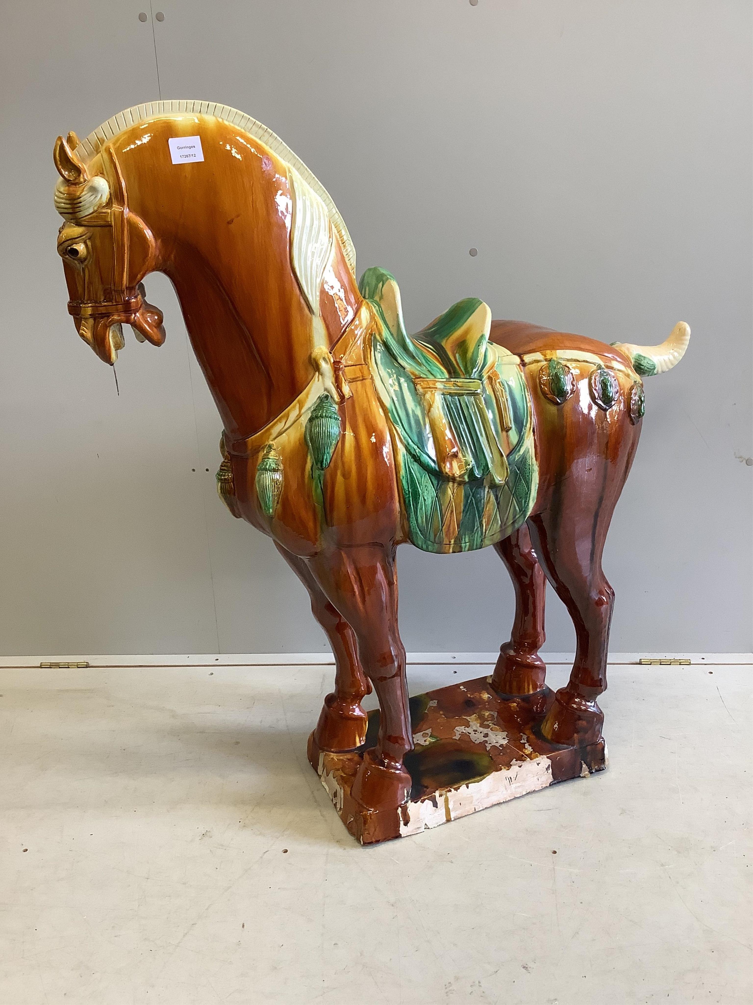 A large modern glazed earthenware Tang style horse, height 114cm. Condition - fair